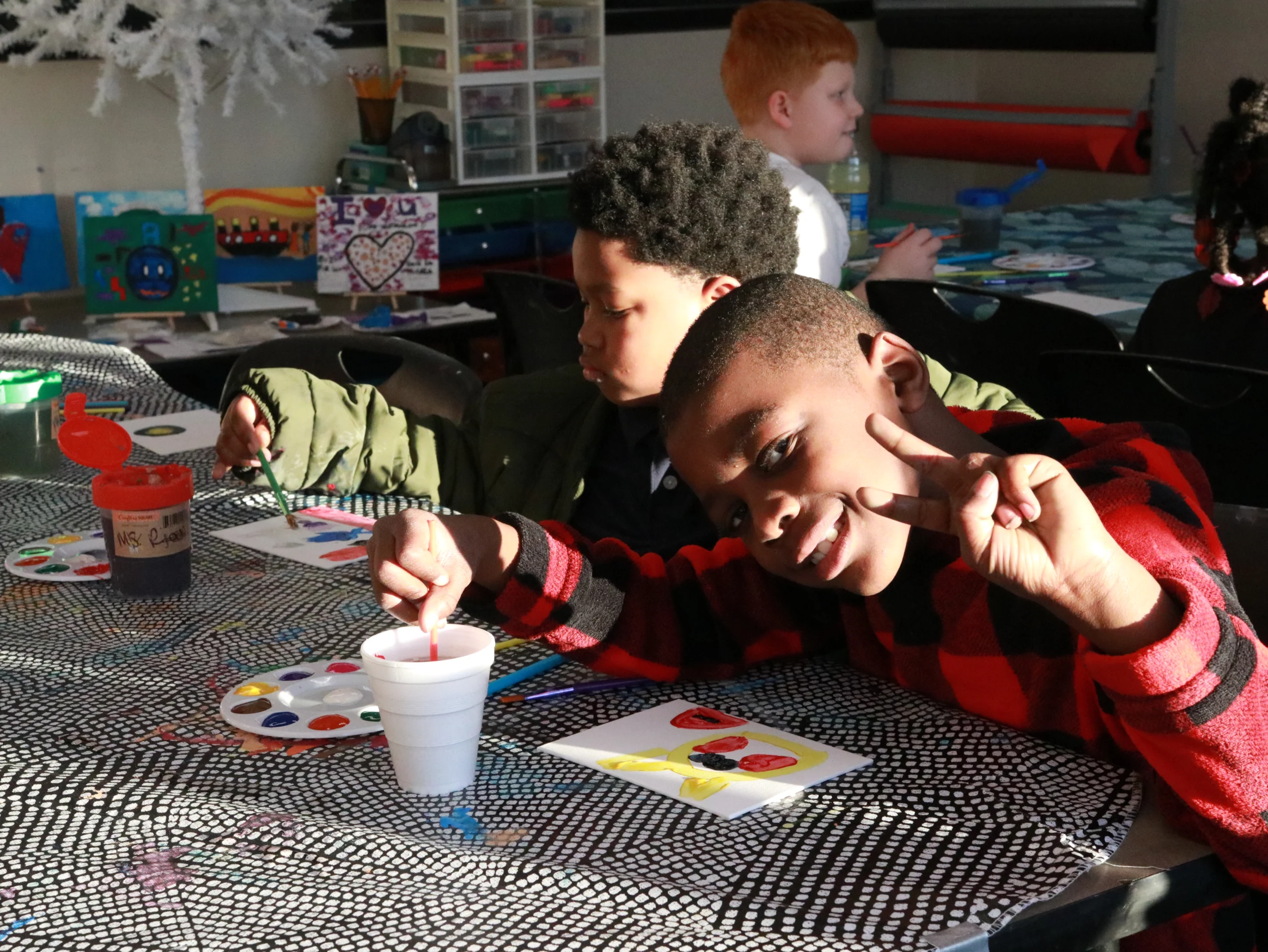Img 6152 Club members painting with watercolors at an art table